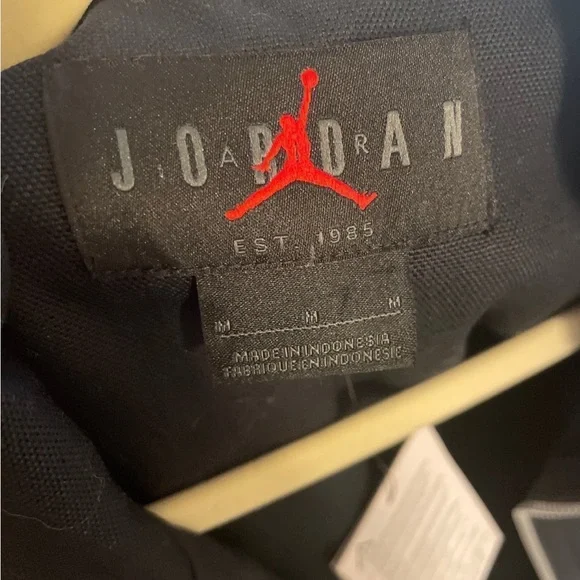 Nike Black Jacket with Red Flame Graphic
